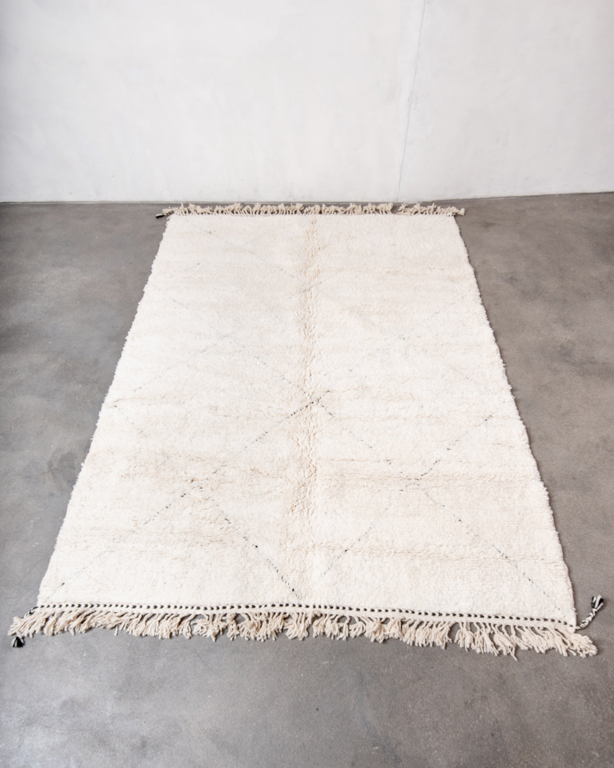 Modern, designer, handcrafted Berber rug from Morocco. Beniourain carpet with minimalist design, natural wool pile and a fluffy texture.